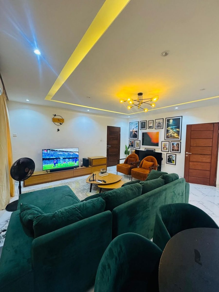 Mini flat living area at Rilwan AJALA Homes set up for entertainment with smart TV